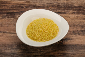 Raw cous cous heap in the bowl