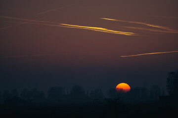 The sun sets over the steppe