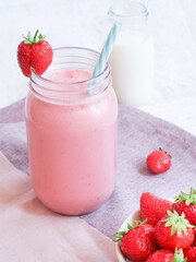 Fresh healthy strawberries smoothie with natural yogurt in a jar, health benefit for diet people concept 