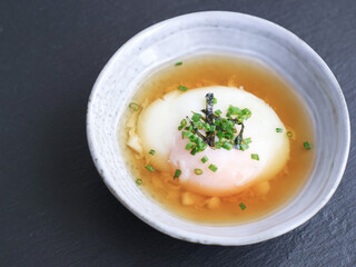 Bowls of traditional Japanese hot spring egg (Onsen Tamago) method of boiling eggs in the hot springs of Japan. Taste like soft custard, mostly famous during summer 