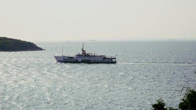 Ferry heading towards Istanbul at sunrise.