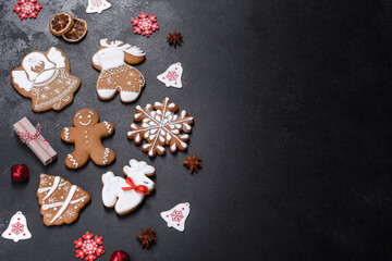 Naklejka na ściany i meble Christmas festive gingerbread made at home on a dark table