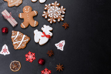 Christmas festive gingerbread made at home on a dark table