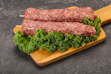 Raw minced beef kebab skewer
