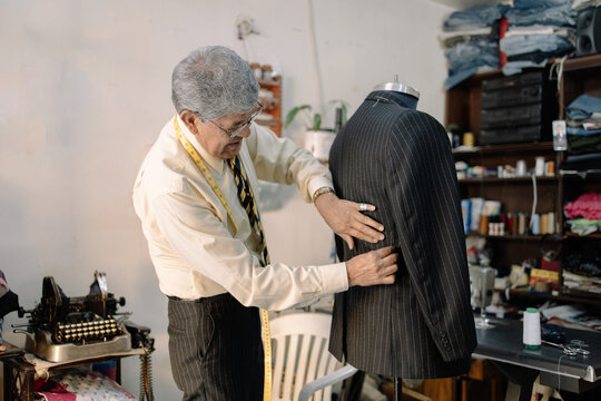experienced mexican tailor working on local business