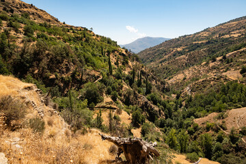 Fototapeta na wymiar Scenic view of the beautiful Poqueira Valley from a hiking trail underneath Capileira village, Las Alpujarras, Sierra Nevada National Park, Andalusia, Spain