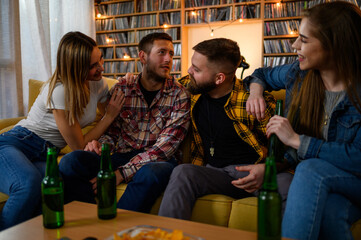 Group of friends on a house party having fun