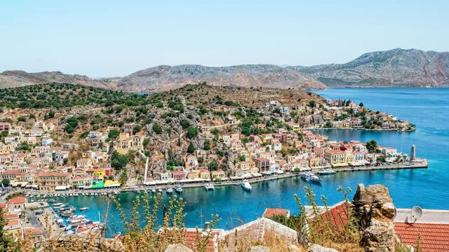 Symi, Greece - June, 2019: 4k Time Lapse. The picturesque island of Simi near Rhodes, part of the Dodecanese island chain, Greece.