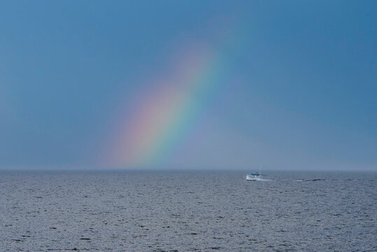 Canadian East Coast Lobster Fishing Boat With Rainbow In Background.