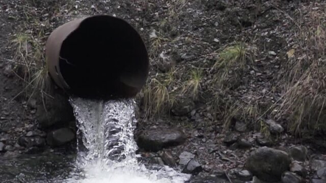 water flows from the drainage pipe. Super slow motion 1000 fps.