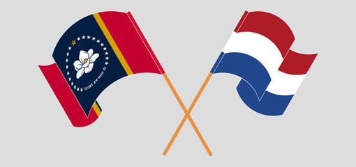 Crossed and waving flags of The State of Mississippi and the Netherlands