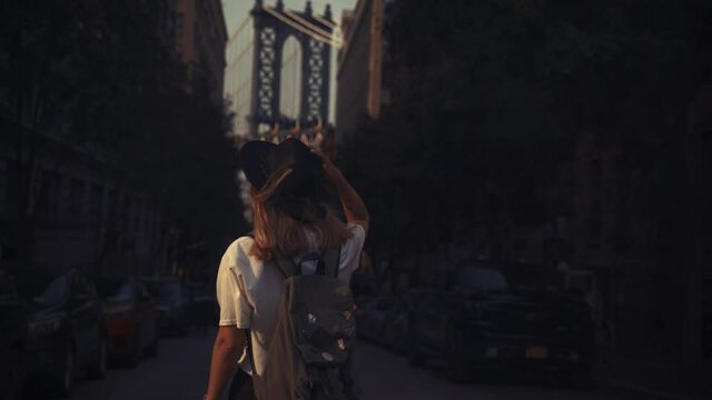 Pretty Woman at The Brooklyn Bridge in New York City at Sunrise