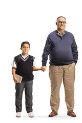 Full length portrait of a mature man holding hands with a schoolboy