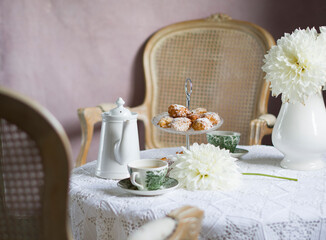 tea break in english style, vintage retro still life, homemade buns and a bouquet of white dalias