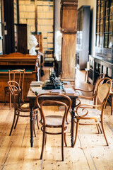 interior of an old house cabinet with books, wooden furniture and lamp