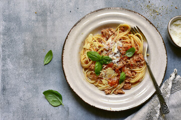Traditional italian dish spaghetti bolognese - pasta with minced meat and tomatoes. Top view with copy space.