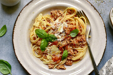 Traditional italian dish spaghetti bolognese - pasta with minced meat and tomatoes. Top view with copy space.