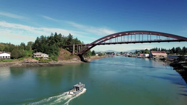 La Connor Washington Aerial of Fishing Boat Passing Under Bridge