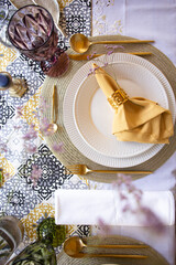 table setting with flowers white plate and cutlery top view