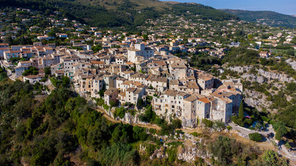 Aerial view of the medieval village of Tourrettes sur Loup in the mountains above Nice on the French Riviera, France - Old stone houses nestled on a belvedere in Provence