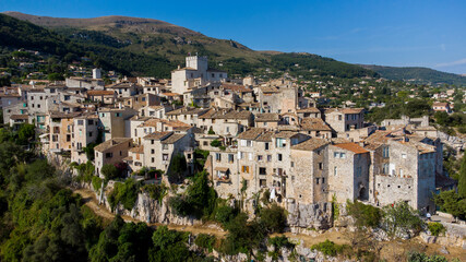 Fototapeta na wymiar Aerial view of the medieval village of Tourrettes sur Loup in the mountains above Nice on the French Riviera, France - Old stone houses nestled on a belvedere in Provence