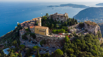 Obraz premium Aerial view of Eze Village, a famous stone village built on a rocky overlook high above the Mediterranean Sea on the French Riviera, in the South of France