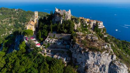 Fototapeta na wymiar Aerial view of the church and the Exotic Gardens of Eze, a famous stone village built on a rocky overlook high above the Mediterranean Sea on the French Riviera, in the South of France