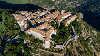 Aerial view of the medieval village of Gourdon in Provence, France - Stone houses built on the edge of a cliff in the mountains of the Gorges du Loup on the French Riviera