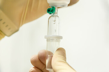 Close-up of a nurse preparing an infusion