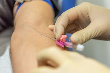 A nurse placing an infusion to a patient