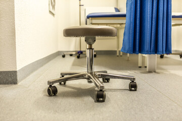 A doctors swivel chair in a surgery room