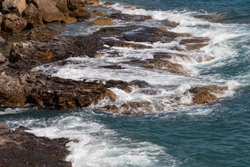 waves crashing on rocks, italian sea