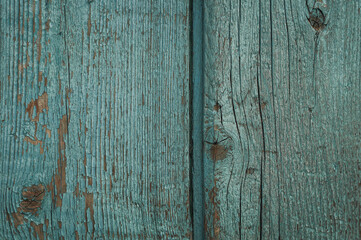 Close-up of old wooden boards with peeling paint. Textured surface. Background