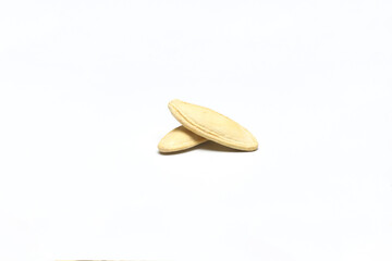 Pumpkin seeds on a white background, isolated. Top view, pumpkin seeds background