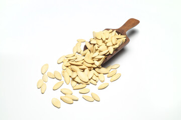 Pumpkin seeds on a white background, isolated. Top view, pumpkin seeds background