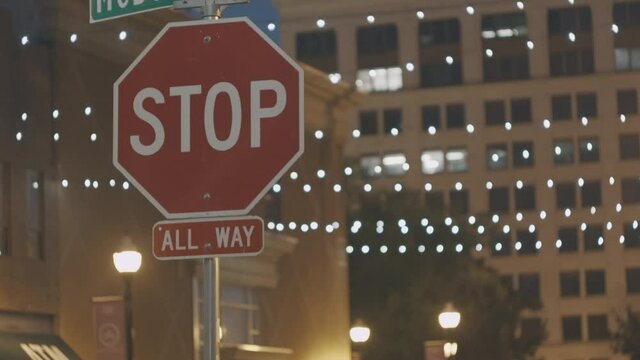 Stop road sign in city. Night city. A forbidding stop sign. High quality 4k footage