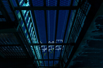 Obraz premium Railway bridge at night in Japan. View from underneath