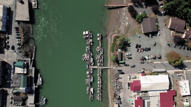 Small Fishing Town with Drone Looking Down on Boat Dock
