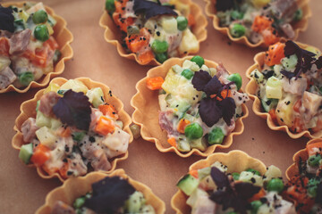 Catering table, beautifully decorated banquet with variety of with different food snacks and appetizers on corporate birthday party event or wedding celebration, seafood, canape, delicatessen setting