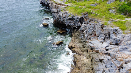 Chong Isariyabhorn (Chong Kao Kad) or Cape Maha Vajiravudh is famous beach sunset point in Si chang island, Chonburi, Thailand.