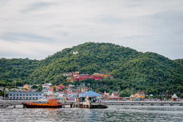 landscape of village on Koh Sichang island with clear sky. Koh Si Chang is one of Tourist Attraction of Thailand.
