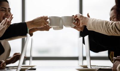 Closeup shot of cups of coffee in hands of unrecognizable unidentified businesswoman colleague...