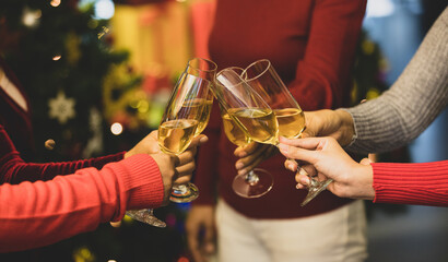 Women on sweater clink glass of ิิbeverage together to start holiday event of jolly drink at gala party for celebrating group success, cheerful relationship
