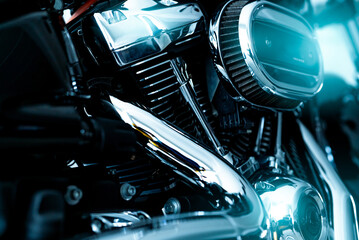 Selective focus on a motorcycle air filter with blur engine and shiny exhaust pipe. Motorcycle...