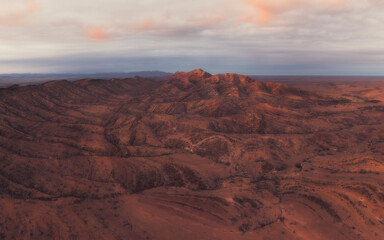 Aerial view over dramatic, rocky, arid terrain in outback Australia