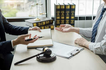 Male lawyers or a judge counseling clients about judicial justice and prosecution with scales,...