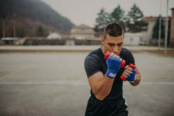 Fototapeta premium Strong professional boxer training in action. Professional fighter, boxer.