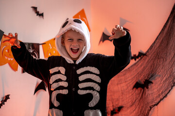 Halloween kids Portrait boy in Halloween skeleton costume at home. Boy is Ready for the trick or...