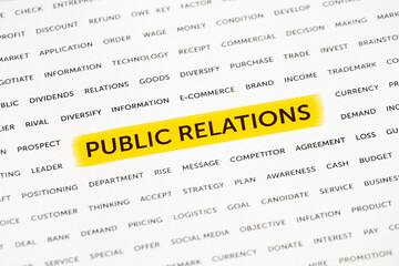 The words "Public relations" is highlighted with a marker on paper. Business concept, strategy, planning, success