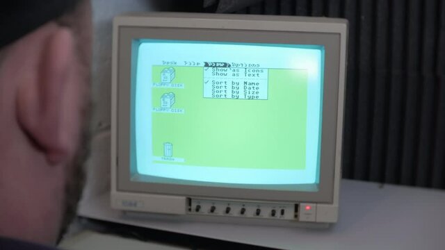 Vintage retro computer screen with green desktop TOS operation system windows